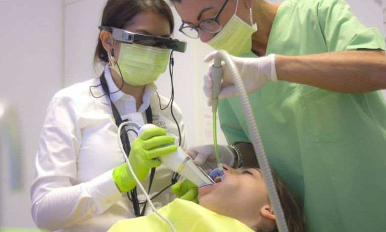 doctors operating on a patient with AR headset